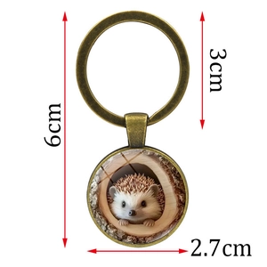 Portachiavi con riccio in tana di albero in lega di bronzo lunghezza totale 6cm