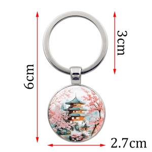 Porte-clés en métal avec pendentif pagode japonaise et fleurs de cerisier roses