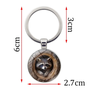 Raccoon in hollow tree metal keychain with glass pendant and 6cm total length