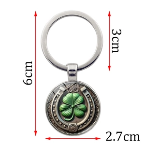 Retro metal four-leaf clover keychain pendant with horseshoe relief and size markings