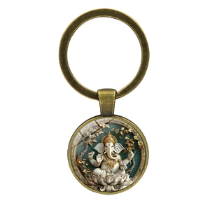Vintage Ganesha keychain pendant with bronze metal ring and artistic glass cabochon