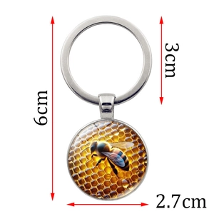 Stylish metallic honeycomb and bee keychain pendant with dimensions 6cm total length
