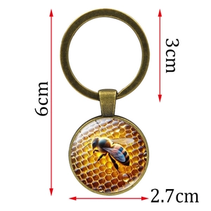 Vintage metal honeycomb bee keychain with a glass pendant, 6cm length product view