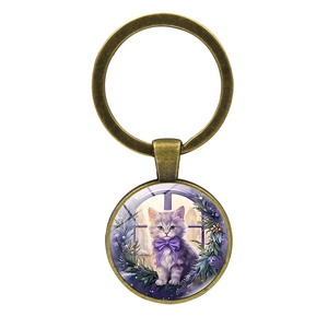 Vintage bronze keychain with purple kitten illustration in a round glass pendant charm