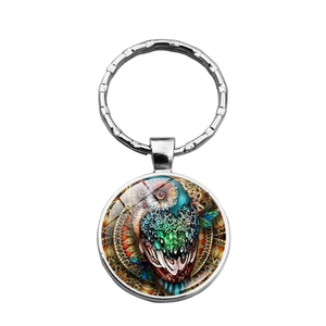 Round owl keychain pendant with colorful bohemian art under a glass dome and silver ring