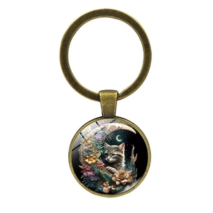 Portachiavi vintage in bronzo con cabochon in vetro motivo gatto e luna fiorita