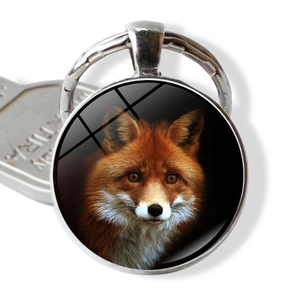 Silver keychain with a round glass cabochon featuring a realistic red fox animal design