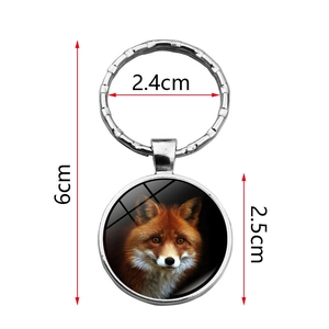 Detailed view of fox pendant keychain with dimensions of six centimeters in length