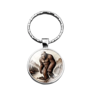 Bigfoot forest scene glass cabochon keychain in silver finish with metal ring