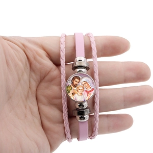 Pink multi-layer woven leather bracelet featuring a Virgin Mary religious glass charm