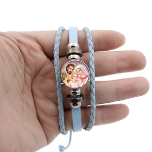 Religious multilayer braided leather bracelet with Virgin Mary glass cabochon charm