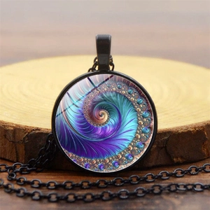 Detail of artistic glass pendant necklace with colorful Fibonacci spiral fractal pattern