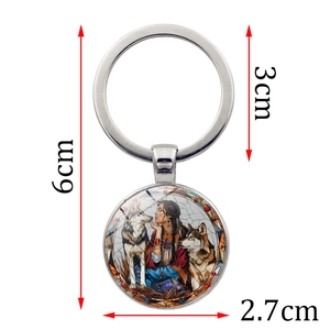 Silver metal keychain featuring a native woman and wolf illustration in stained glass style