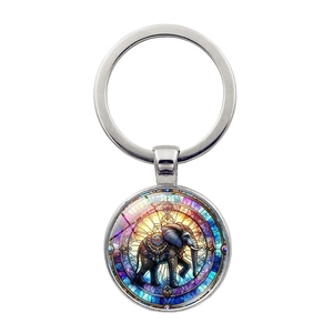 Porte-clés argenté rond avec pendentif cabochon en verre motif éléphant bohème