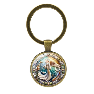Vintage bronze angel and dove glass cabochon keychain with artistic floral pattern