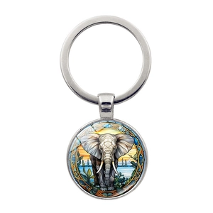 Porte-clés cabochon en verre avec éléphant et illustration de coucher de soleil