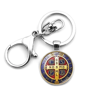 Saint Benedict Medal keychain with red blue enamel and lobster clasp on white background