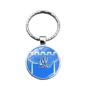 Detailed view of silver metal keychain with blue JW.ORG glass gem and polished finish