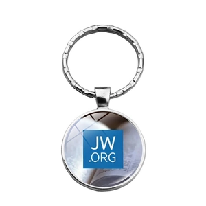 Close-up of circular metal keychain with blue JW.ORG glass cabochon pendant