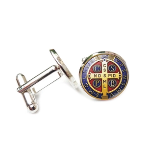 Detail of silver St. Benedict Medal cufflinks with blue and red enamel inlay work