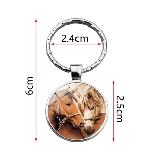 Silver metal horse pattern pendant keychain with circular glass dome and dimensions