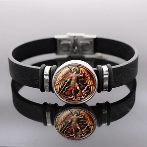 Macro detail of Archangel St. Michael black leather bracelet with steel buckle