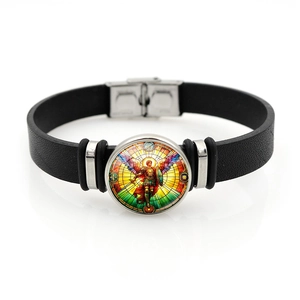 Close-up of Saint Michael Archangel black leather bracelet with glass cabochon charm