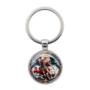 Detail of metal keychain featuring Archangel Michael defeating the devil religious icon