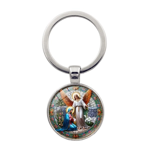Archangel Michael metal keychain with colorful religious scene pendant on white background