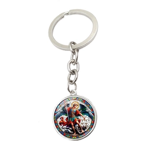 Detailed view of Saint Michael Archangel art pendant on a silver metal keychain