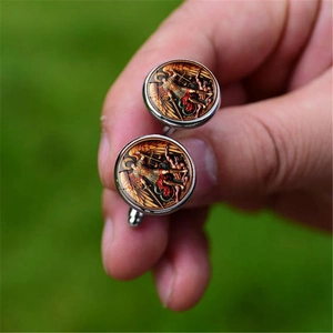 Detailed close-up of Archangel Michael cufflinks with silver metal base and glass cabochon