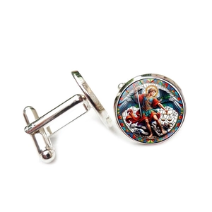 Detailed close-up of Saint Michael glass dome cufflinks with silver-toned polished metal finish