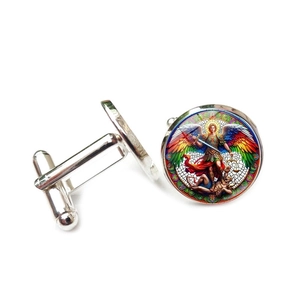 Macro detail of Archangel Michael cufflinks with vibrant stained glass art inlay