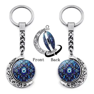 Rotating silver crescent moon evil eye keychain with blue mandala double-sided charm