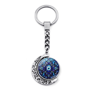 Evil eye moon keychain with rotating mandala pendant in polished silver finish