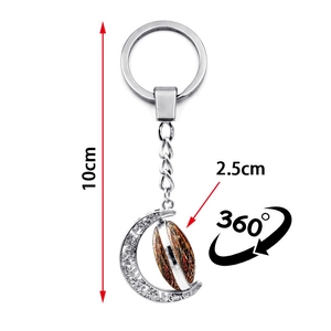 Macro view of Archangel Michael rotating moon keychain with 10cm total length dimension