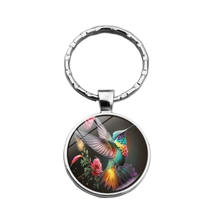 Colgante cabujón de cristal con colibrí y flores con llavero de plata metálica