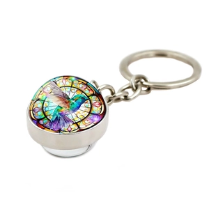 Llavero artístico de colibrí con bola de cristal y motivo de vitral en metal plateado fino