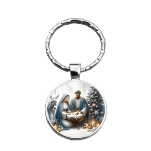Polished silver metal Christmas keychain featuring Holy Family and Nativity scene illustration