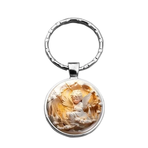 Polished silver metal angel keychain with round pendant featuring a yellow castle backdrop
