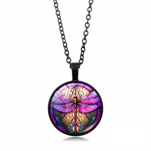 Detailed view of round dragonfly pendant with stained glass effect on black metal chain