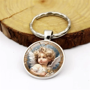 Vintage angel glass gem keychain with flower detail on rustic wooden display stand