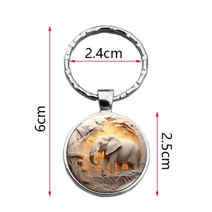 Elegant silver elephant keychain with savanna scene engraving showing precise dimensions