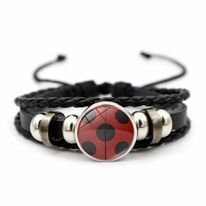 Multilayer braided leather bracelet featuring ladybug polka dot glass charm and metal beads