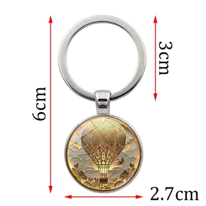 Porte-clés montgolfière en métal avec motif vintage et longueur totale de 6cm