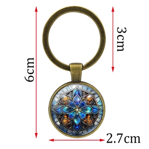 Porte-clés mandala en métal bronze avec pendentif floral bleu sous dôme de verre