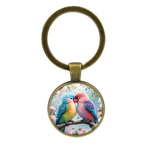 Porte-clés vintage en bronze avec pendentif cabochon en verre et motif inséparables
