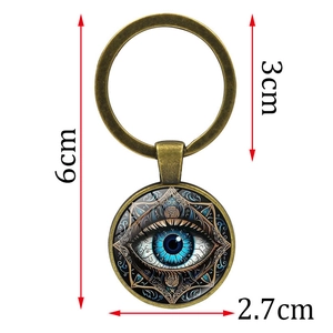 Vintage bronze evil eye keychain with blue mandala glass dome charm and size specs