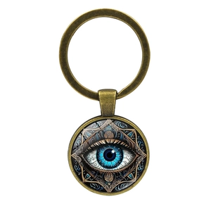Vintage bronze evil eye keychain with blue mandala pattern and glass dome pendant
