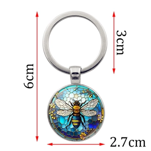6cm bee themed glass cabochon keychain with blue honeycomb and colorful insect motif